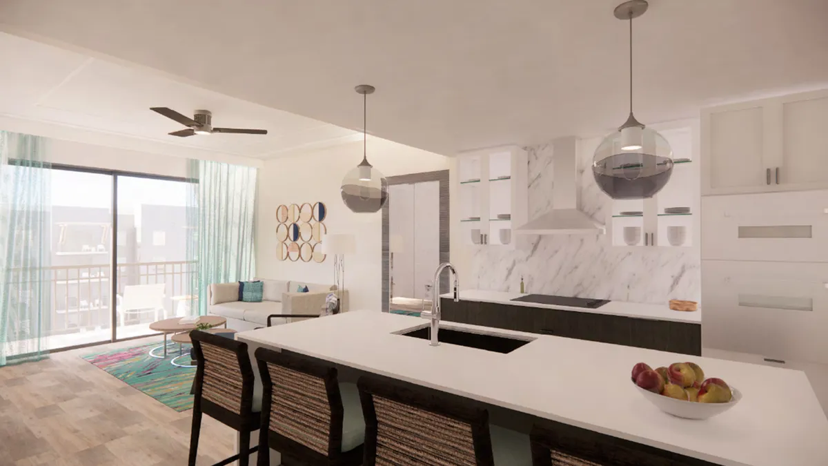 A vibrant living and kitchen area with plush designer seating, a kitchen island for shared meals, colorful wall art, and large windows letting in abundant light. The scene is arranged for entertaining, relaxing, and socializing, emphasizing warmth and togetherness.